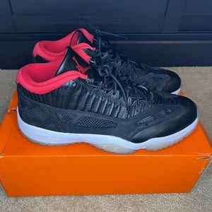 Jordan 11 ie low black and red. Size 13